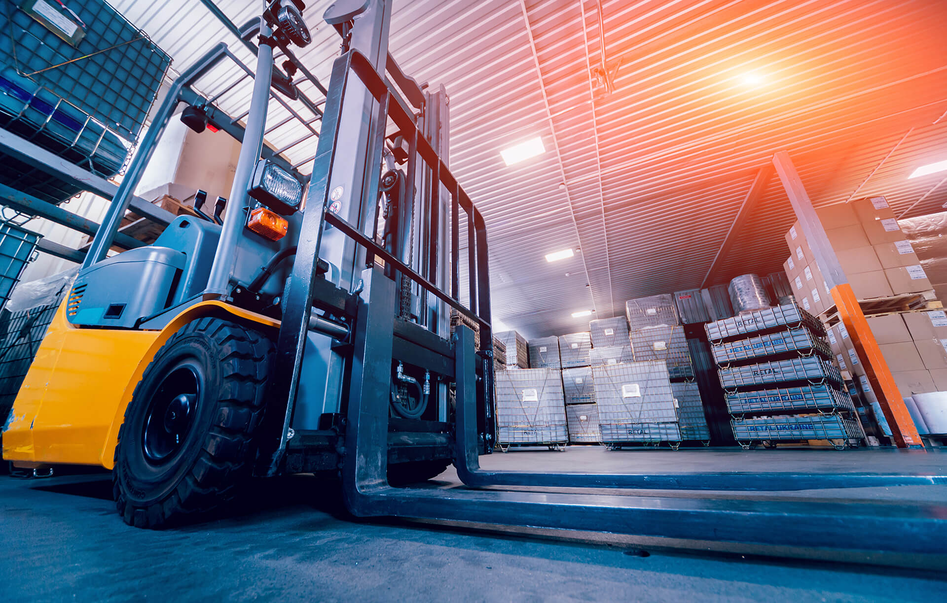 pallet loader and pallets in background