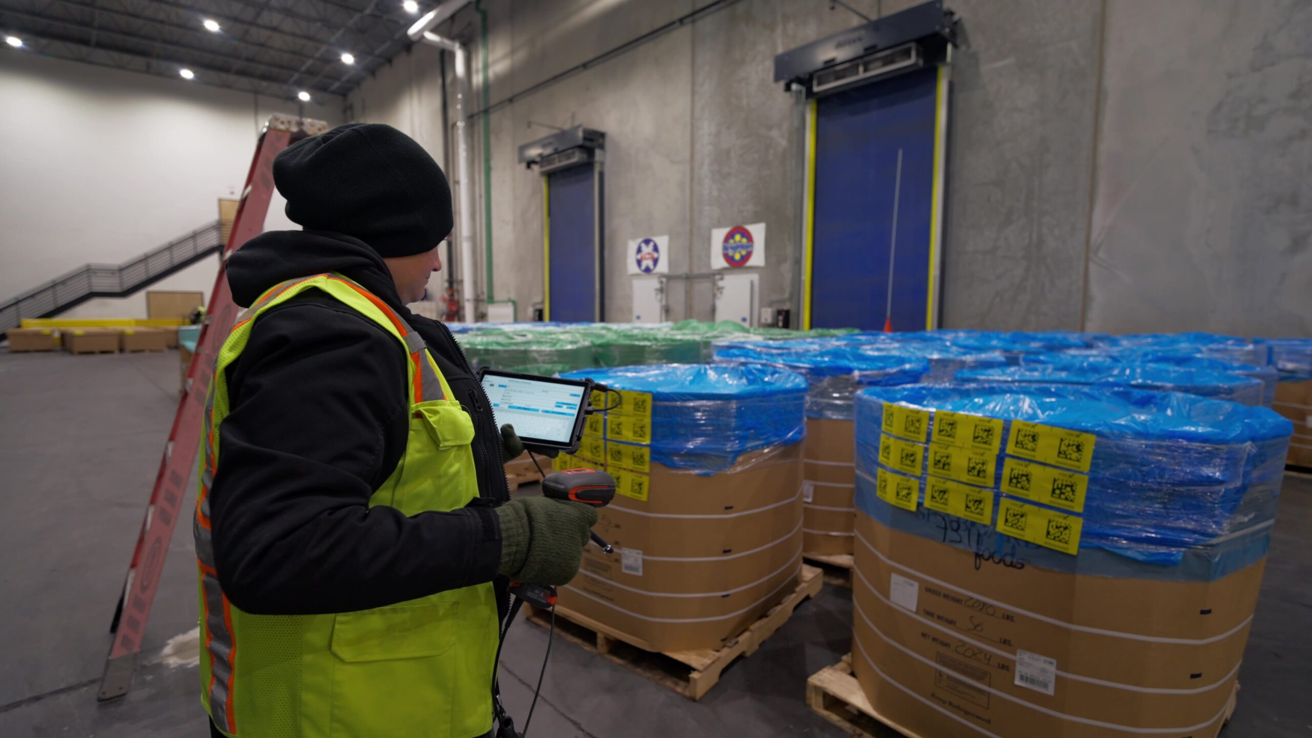 Employee scanning pallets in cold storage Utah